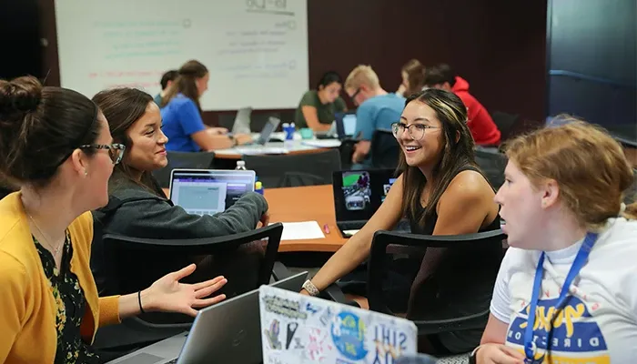 students have a discussion during a class